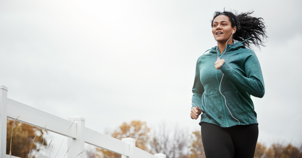 Young woman going for a run in nature